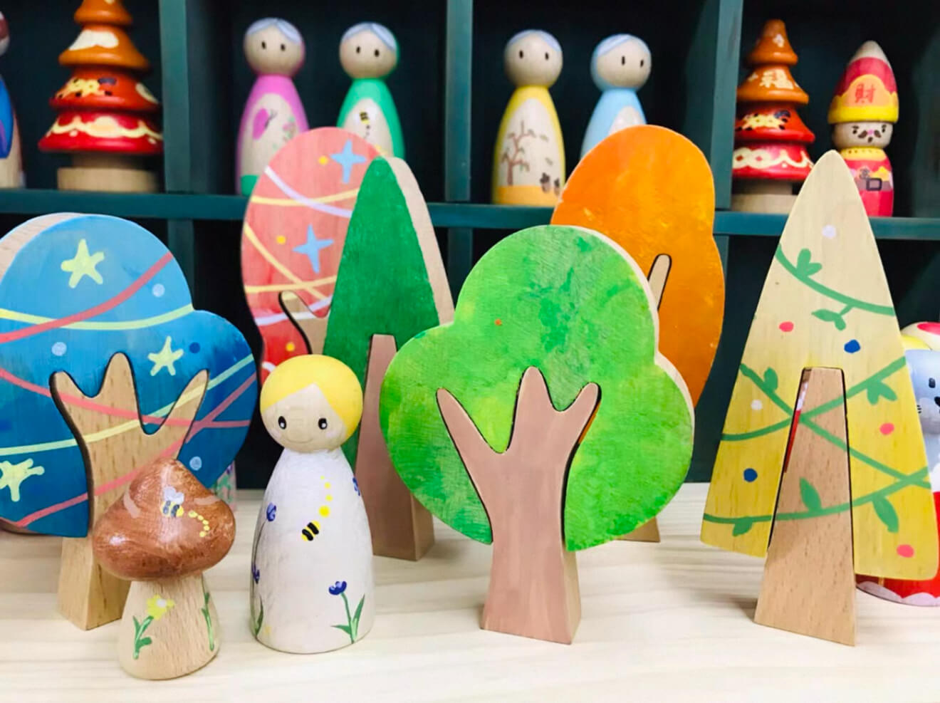 Colorful customer wooden forest and peg doll display