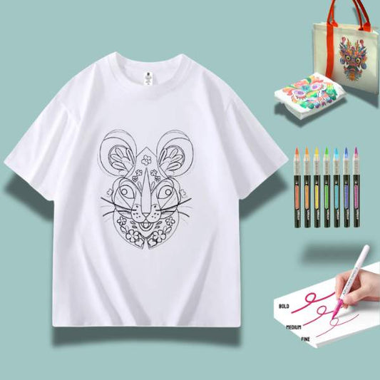 A white t-shirt featuring a detailed doodle of a proud rat, surrounded by art supplies including markers and watercolor paints.