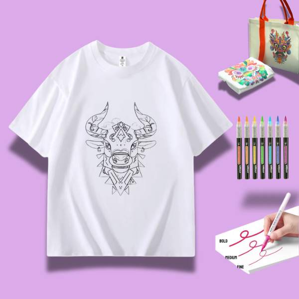 A white t-shirt featuring a detailed doodle of a proud ox, surrounded by art supplies including markers and watercolor paints.