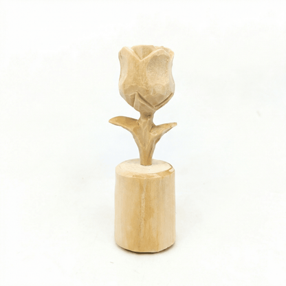 A handcrafted wooden rose flower decoration on a cylindrical base.