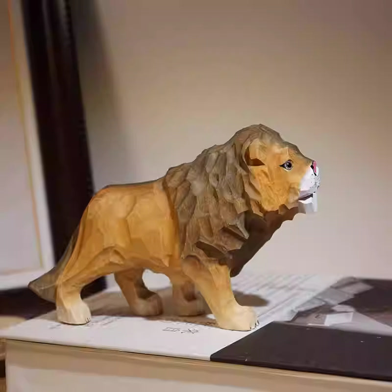 A beautifully carved wooden lion figurine displayed on a surface.