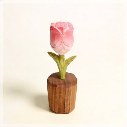 A beautifully crafted blue wooden flower in a brown pot.