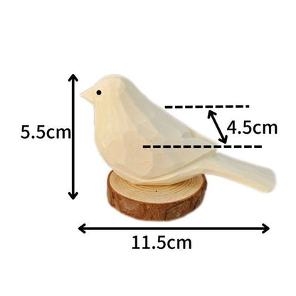 A decorative wooden bird figure resting on a circular wooden base, measuring 11.5cm in width and 5.5cm in height.