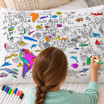 Back view of a child coloring a detailed world map pillowcase with fabric markers