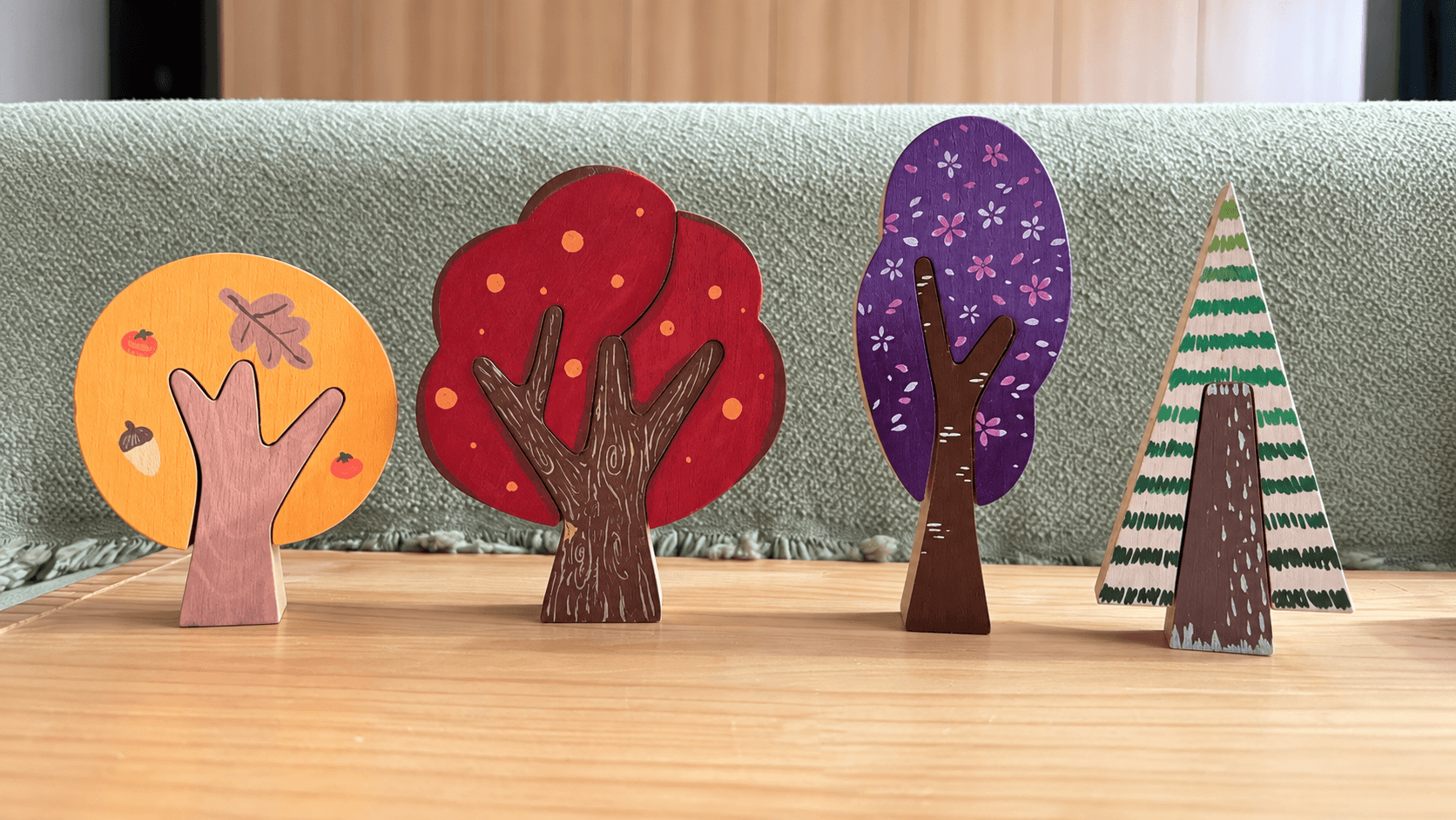 Colorful painted wooden trees in warm autumn colors