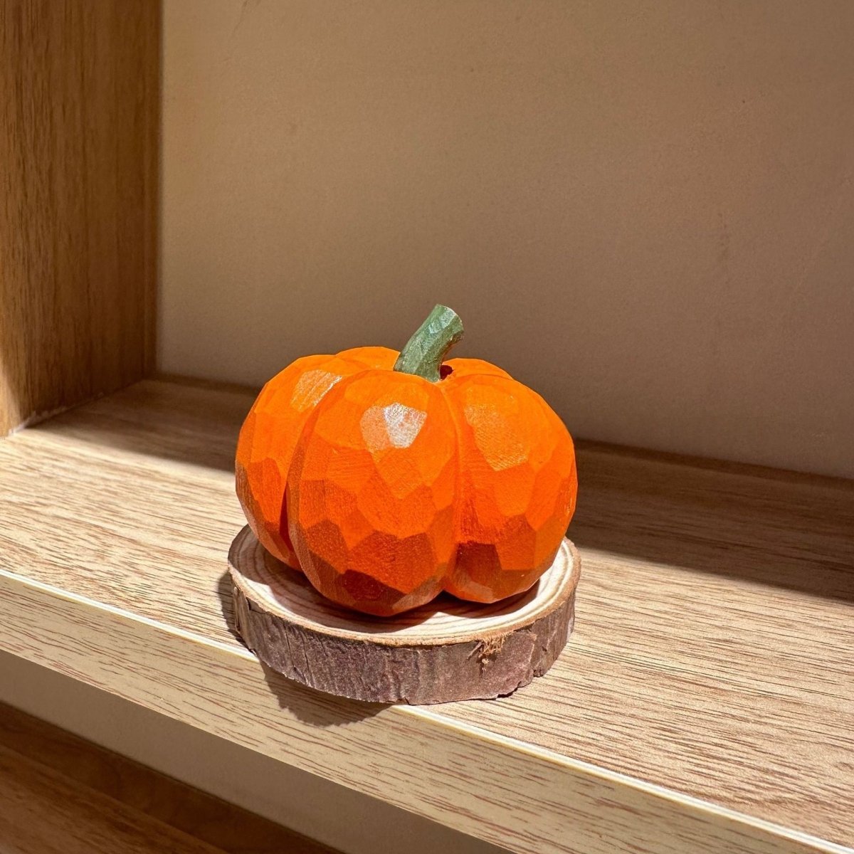 Small hand-carved wooden pumpkin figure suitable for Halloween and autumn decoration