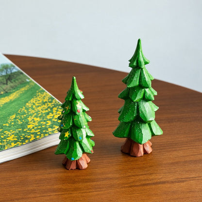 Small decorated wooden Christmas tree displayed as festive tabletop decor