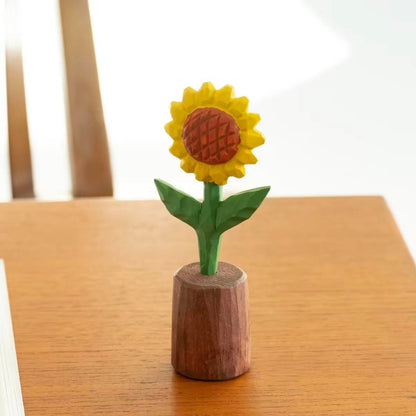 Finished hand-painted wooden sunflower craft displayed in a wooden pot