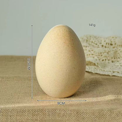 A decorative acrylic egg on a burlap surface, showcasing its dimensions of 12.5 cm height and 9 cm width.