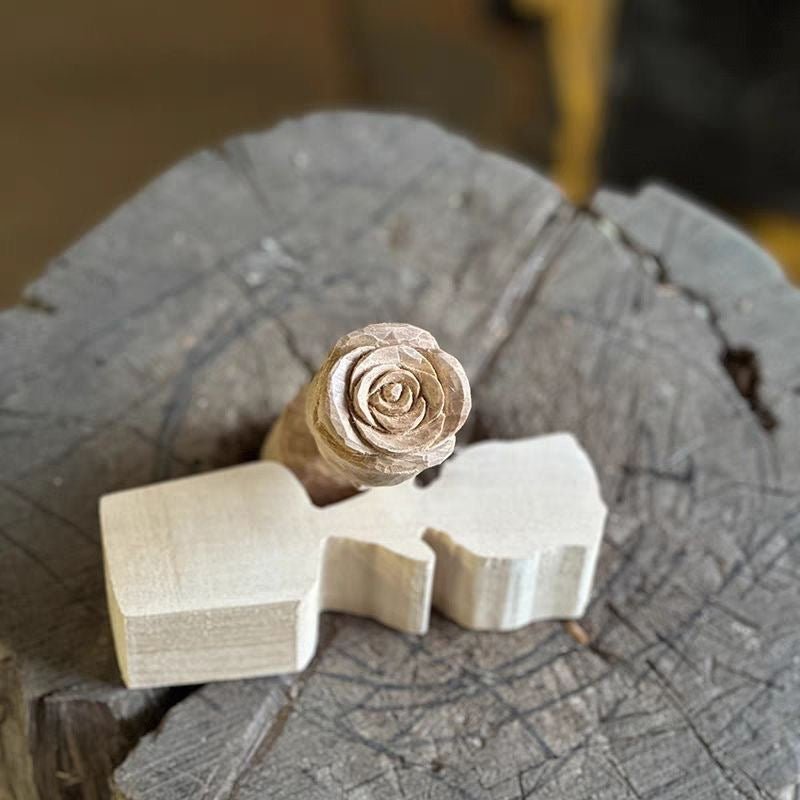 A person is skillfully carving a wooden product with a knife.