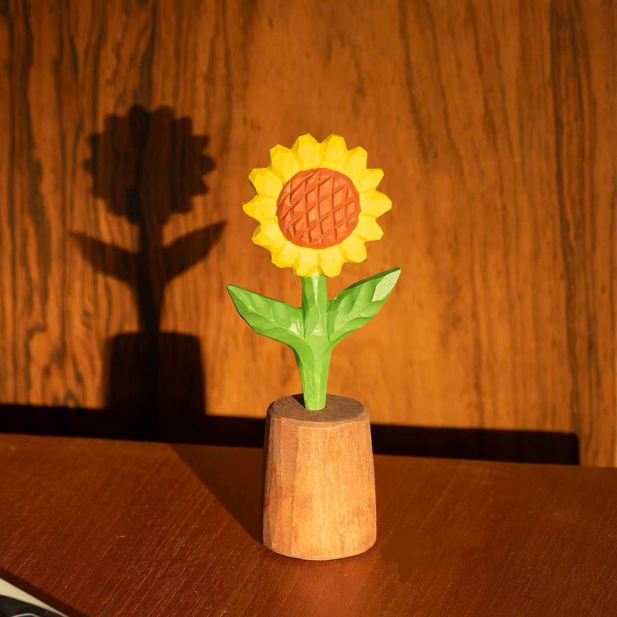 Hand-carved wooden sunflower displayed as colorful home decor