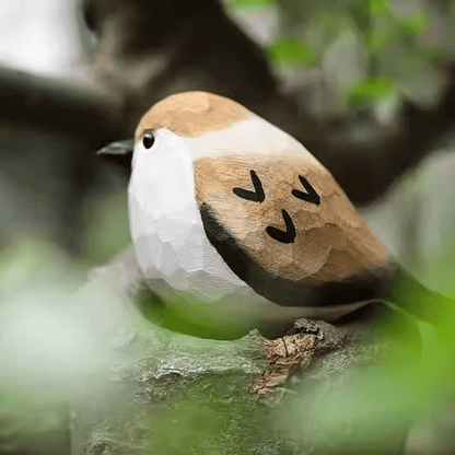Meticulously painted sparrow figurine resting on a branch, perfect for rustic nature decor