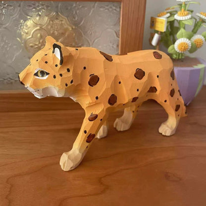 Close-up of painted details on a DIY wooden leopard figure