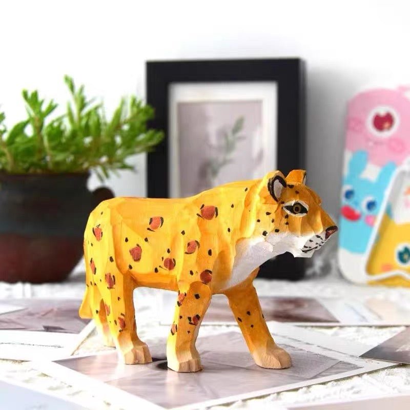 Finished painted wooden leopard craft standing on a tabletop
