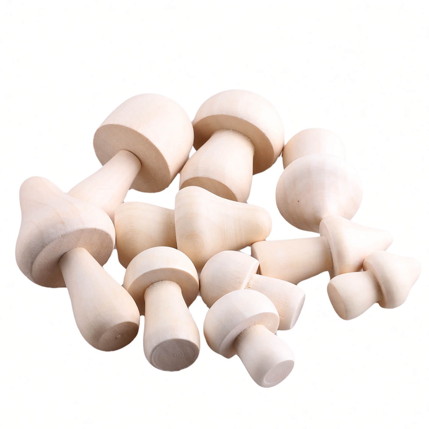 Painted wooden mushrooms displayed as home decor on a windowsill