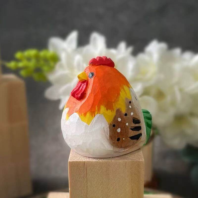 Close-up of a hand-painted wooden rooster figurine with colorful details