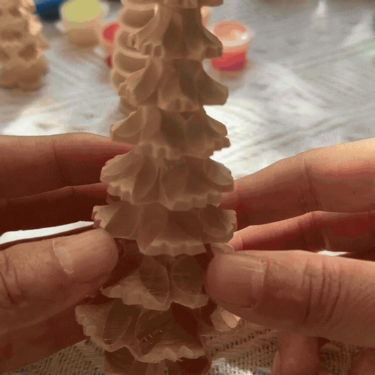 painted and unpainted wooden Christmas trees from DIY craft kit
