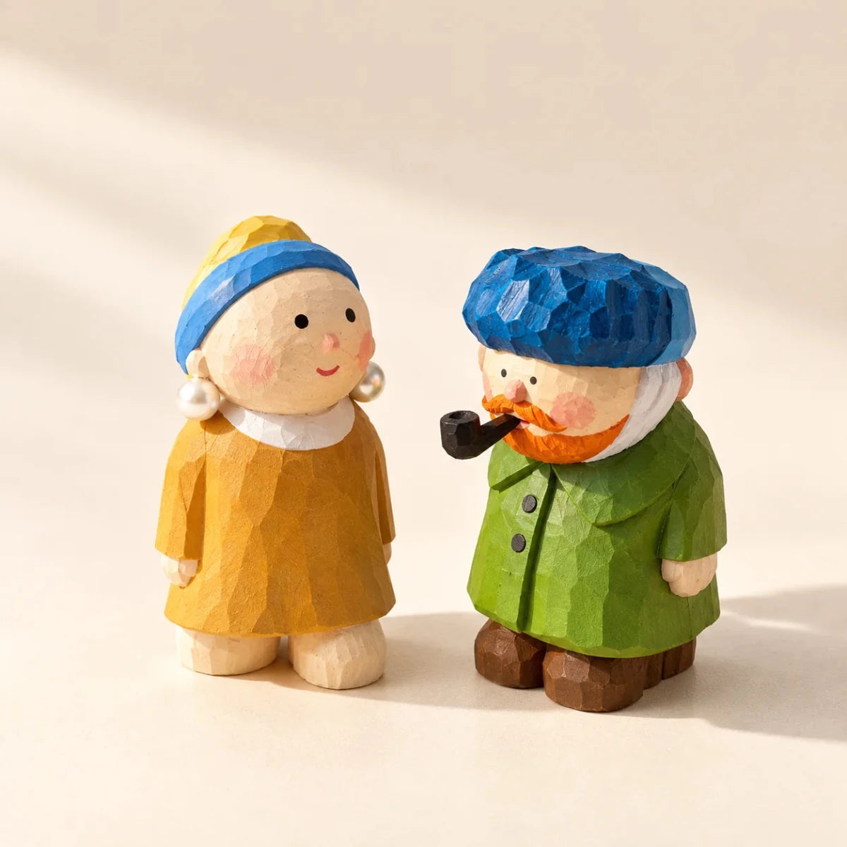 Pearl Girl and Van Gogh hand-carved wooden figurine set displayed on a cream background