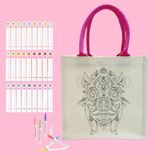 Canvas tote bag featuring a cute pig outline ready for DIY coloring and painting.