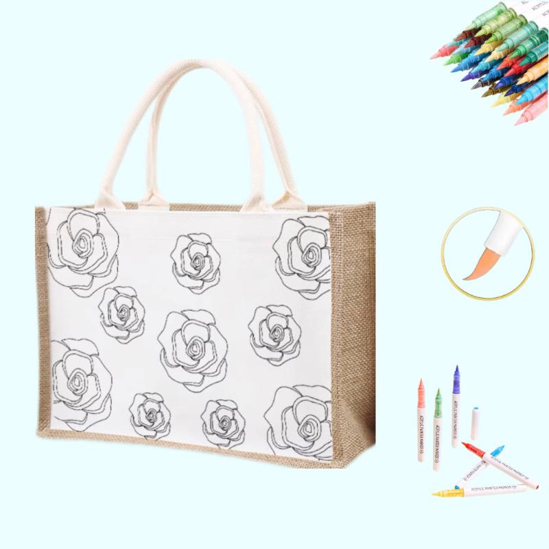 A tote bag featuring a rose design with coloring tools for a DIY project