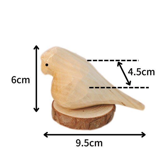 A wooden bird figurine on a slice of wood, measuring 9.5cm in length, 6cm in height, and 4.5cm in width.