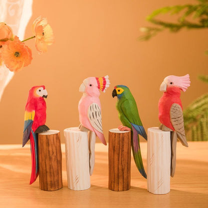 Colorful wooden decorative birds perched on logs