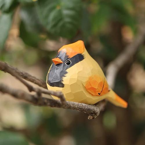 A DIY acrylic-painted wooden bird sculpture with a tan body, orange head and wings, and black beak, ideal for home decor and creative projects.