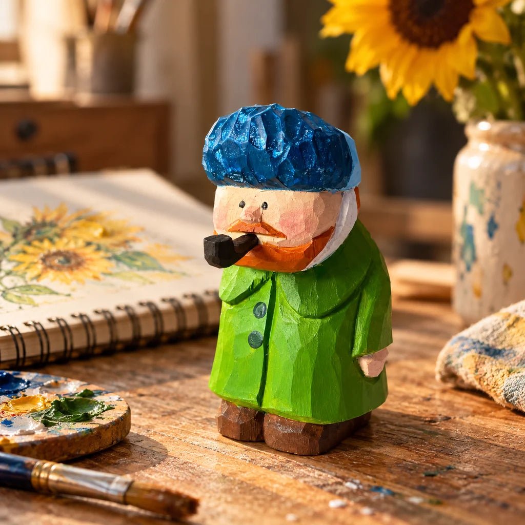 Hand-carved Van Gogh wooden figurine displayed with paintings and art studio supplies