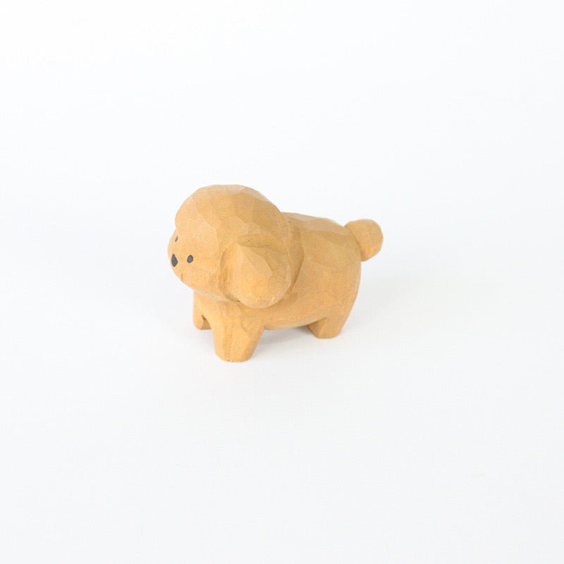 A handcrafted wooden dog figurine with a cute and playful design.