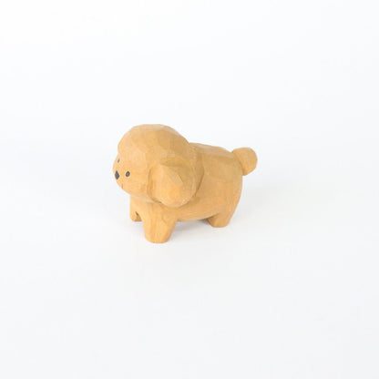 A handcrafted wooden dog figurine with a cute and playful design.