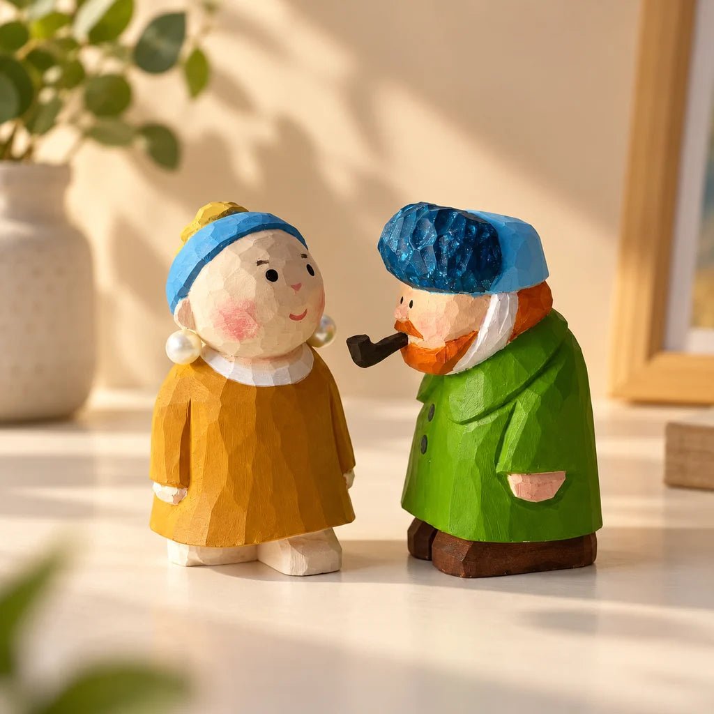 Pearl Girl and Van Gogh hand-carved wooden figurines facing each other on a tabletop