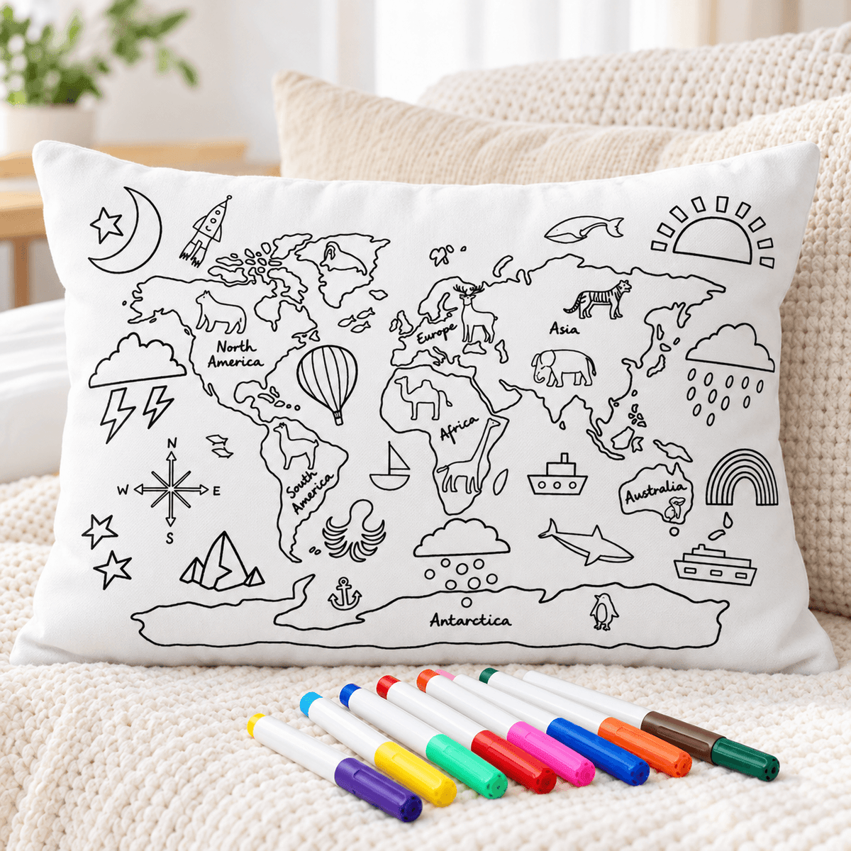 Uncolored world map coloring pillowcase with animals, landmarks, and colorful fabric markers